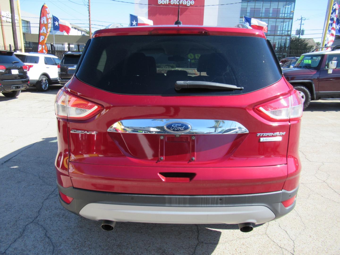 2014 Red /Black Ford Escape Titanium (1FMCU0J98EU) with an 2.0 engine, Automatic transmission, located at 1511 North Shepherd Dr., Houston, TX, 77008, (281) 657-1221, 29.798361, -95.412560 - 2014 FORD ESCAPE TITANIUM VIN: 1FMCU0J98EUA29272 1 F M C U 0 J 9 8 E U A 2 9 2 7 2 4 DOOR WAGON/SPORT UTILITY 2.0L I4 F DOHC 16V GASOLINE FRONT WHEEL DRIVE - Photo#17